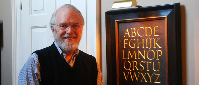 Dr. John Warnock in his home. Photo by Kendall Whitehouse.
